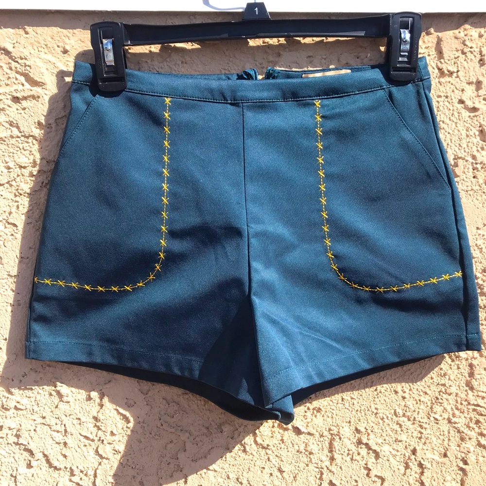 Lyn around green shorts